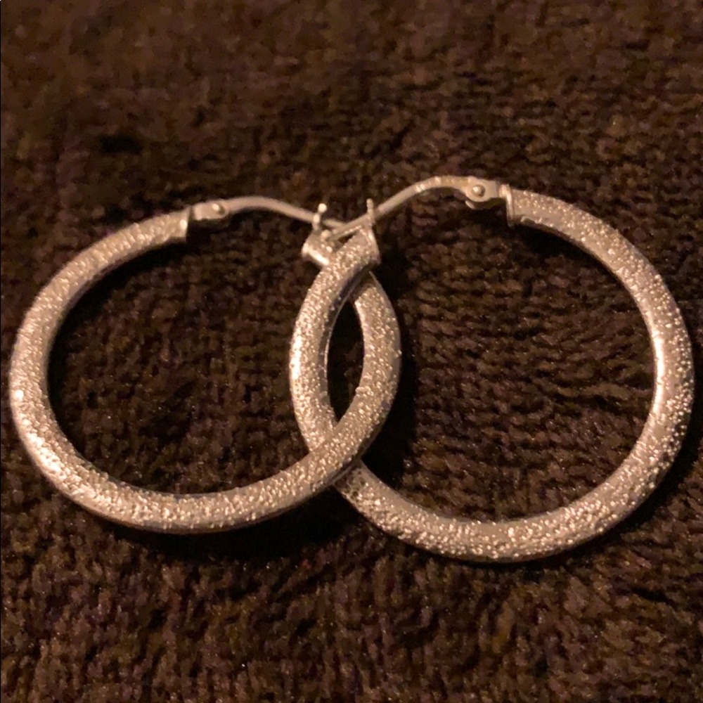 Silver loops earrings all most size of quarter